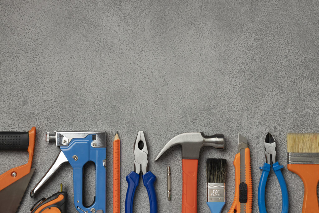 top-view-steel-hammer-with-other-construction-elements-tools